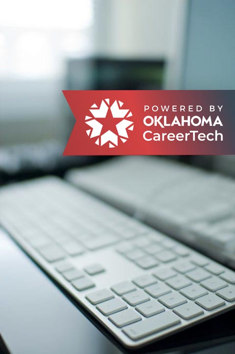 Oklahoma CareerTech logo with a blurred desktop computer in the background