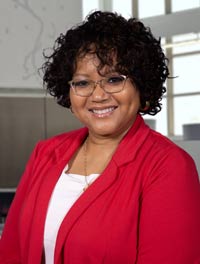 Dr. Durant-Tyson, standing in the Client Service Center