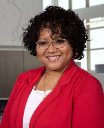 Dr. Durant-Tyson, standing in the Client Service Center