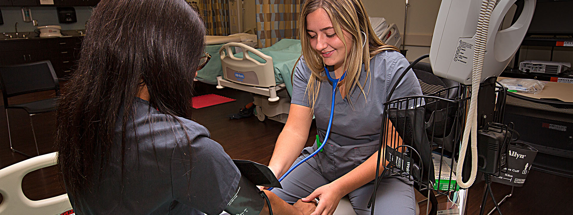 A student measuring blood pressure