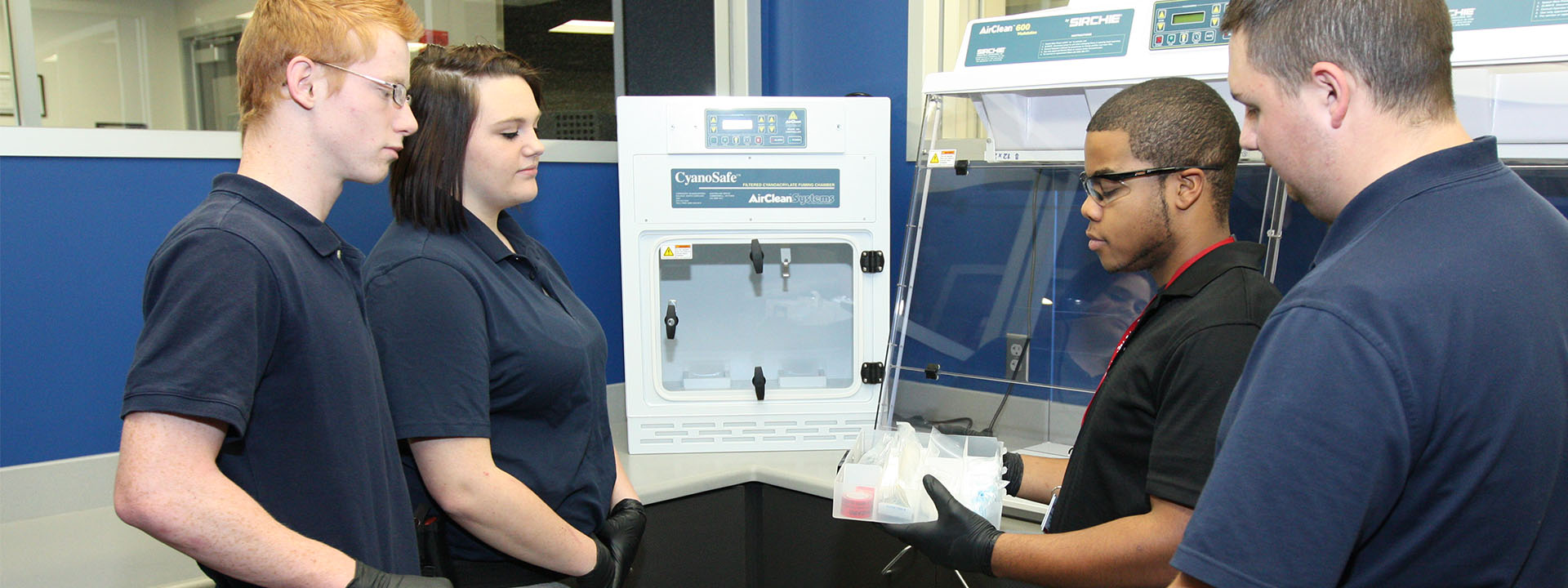 Criminal Justice students work with equipment