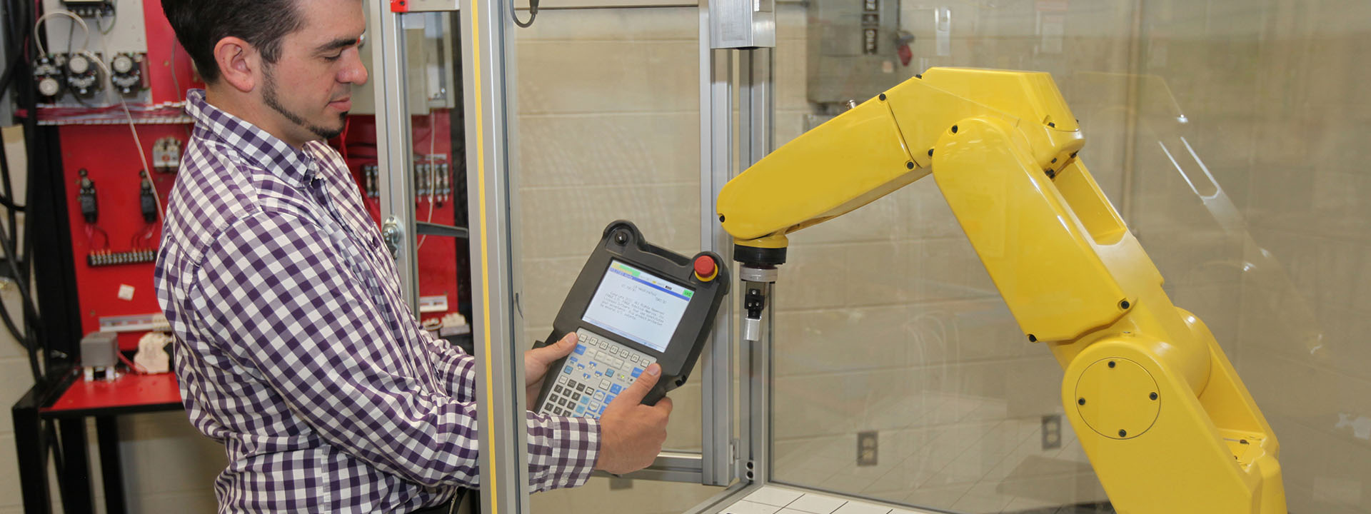 An Instructor calibrates a robotic arm