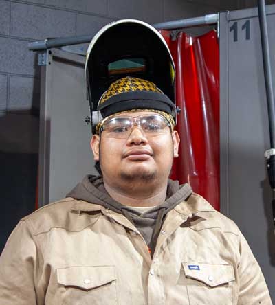 Jairo, a Tulsa Tech student wearing welding mask